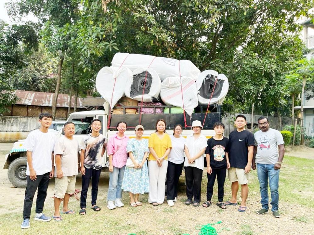 Members of YTWN, Moa Baptist Church, Kuda Village and others pose in-front of the relief materials to be transported to Manipur, at Moa Baptist Church, Kuda Village on June 4. (Morung Photo)